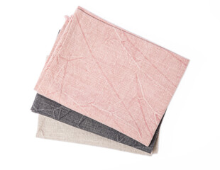 Kitchen towel .Stack of napkins isolated on white background. Picnic towel. Home textiles. Folded cloth.Food serving design element. Square napkin.