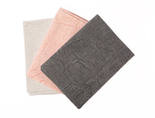 Kitchen towel .Stack of napkins isolated on white background. Picnic towel. Home textiles. Folded cloth.Food serving design element. Square napkin.