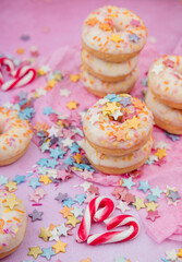 donuts with sprinkles on pink background