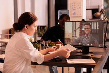 Colleagues discussing annual company report on corporate online meeting, employees talking about business presentation using videocall application. Executive manager speaking on teleconference
