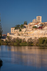 Beautiful panoramic view of Zamora cityscape during Autumn season, from the other side of the Douro River, in Spain.