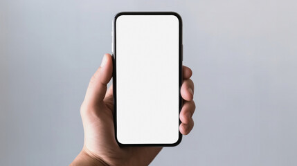 Mockup image of a hand holding black mobile phone with blank white screen on gray background. Created with Generative AI tools 