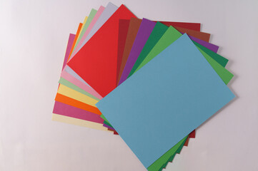 Stack of colorful paper of different colors ,top view.