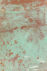 Rusty metal surface with old faded paint. Texture of rust and paint. Grunge background