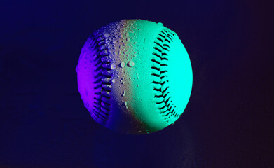 Neon light on baseball ball closeup for pop art style baseball with water on it for rain game concept.