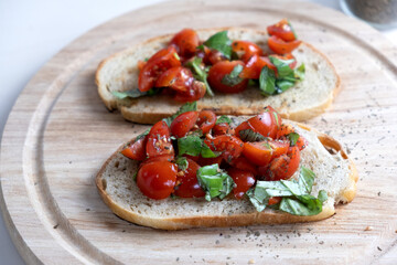 Fototapeta na wymiar Sandwiches with baked cherry tomatoes. Bruschetta with tomatoes