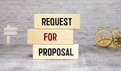 Closeup on businessman holding a wooden block with Request for proposal, Business concept.