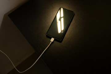 Fototapeta na wymiar smartphone battery charging
