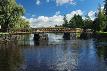 Fototapeta na wymiar Ancient Footbridge To Olavinlinna Castle In Savonlinna Finland On A Beautiful Sunny Summer Day With A Clear Blue Sky