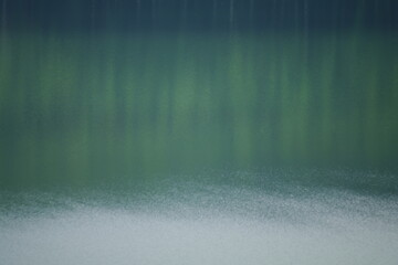 A landscape photo with a mysterious atmosphere where the scenery is reflected on the surface of the lake.