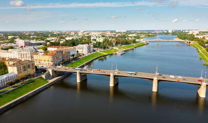 Fototapeta na wymiar Scenic cityscape of Tver city located on Volga river overlooking residential areas and bridges on sunny summer day, Russia