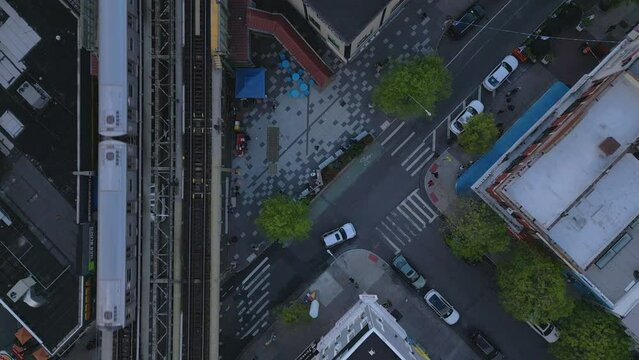 overhead aerial view of intersection next to elevated subway track in Bushwick Brooklyn