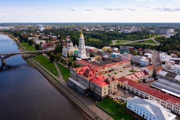 Aerial view of the administrative center of the city of Rybinsk with the Transfiguration Cathedral, as well as the original ..road bridge over the Volga River on a summer day, Russia