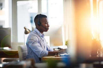 He is all about solving problems. a male agent working in a call centre.