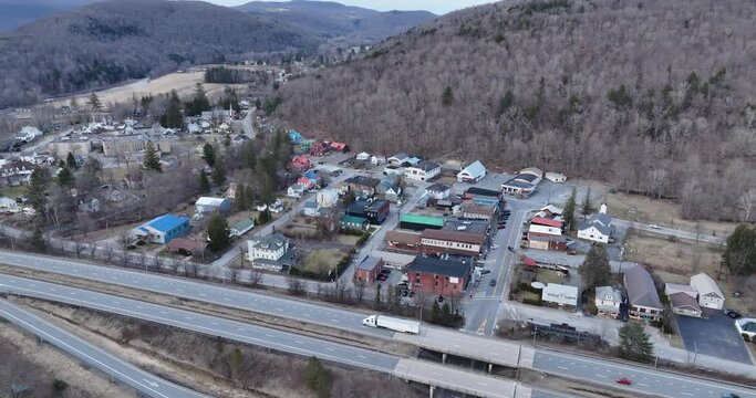 Scenic aerial view of Roscoe NY and Tree Covered Mountains in the Catskills 
