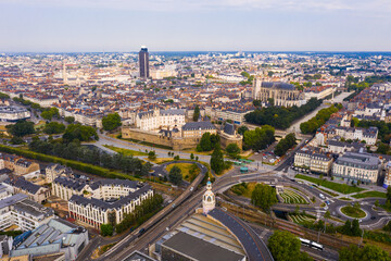 Scenic aerial view of French city of Nantes at cloudy summer day - obrazy, fototapety, plakaty