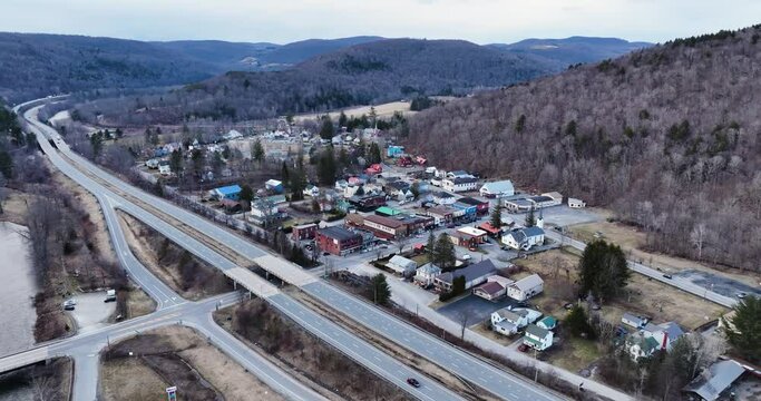Scenic aerial view of Roscoe NY and Tree Covered Mountains in the Catskills 
