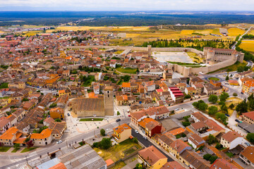 Fototapeta na wymiar Scenic view from drone of Cuellar cityscape with medieval Castle of Dukes of Alburquerque, Spain