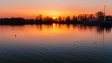 Obraz na płótnie Canvas Sunset with reflections near Plattling, Isar, Bavaria, Germany