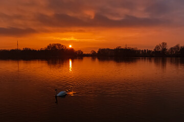 Sunset with reflections near Plattling, Isar, Bavaria, Germany
