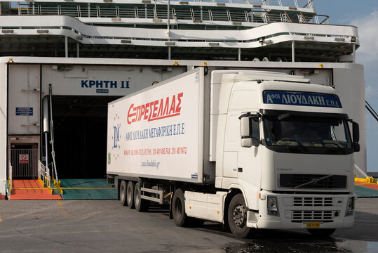Herkalion Port, Crete,  Greece, EU. 2023. A truck and trailer loading onto a Greek ferry in the port at Herkalion, Crete.