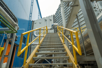 Heat recovery Steam Generator with pipe line, air intake and Up stair. The photo is suitable to use for industry background photography, power plant poster and electricity content media.