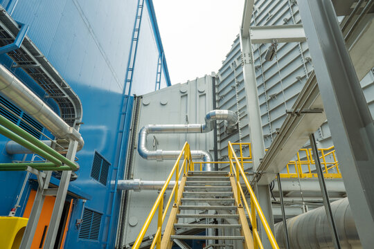 Heat recovery Steam Generator with pipe line, air intake and Up stair. The photo is suitable to use for industry background photography, power plant poster and electricity content media.