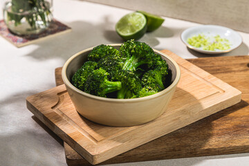bowl of cooked blanched broccoli trees