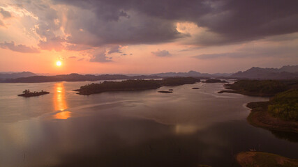 Fototapeta premium aerial view amazing sky above the lake in sunset at Pompee view point Kanchanaburi Thailand..Imagine a fantasy bright sky at sunset..Gradient color. Sky texture, abstract nature background.