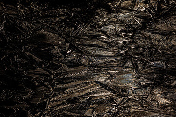 Light from a full moon reflects of cracked ice during the night and creates colourful reflections