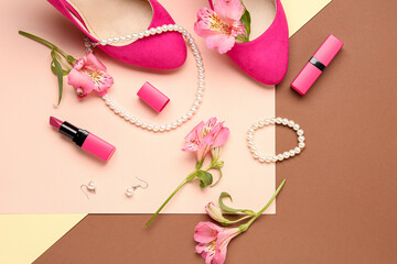 Composition with beautiful female accessories, heels, lipstick and alstroemeria flowers on color background