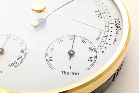 Aneroid barometer on white background, closeup
