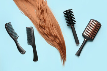Ginger hair with brushes on blue background