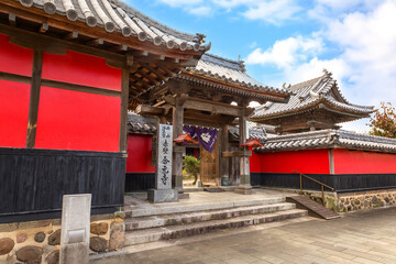 Fototapeta premium Goganji Temple (Red Wall Temple) established by the daimyo Kuroda Yoshitaka and founded by the priest Kuyo, situated a little south of the center of the Tera-machi district