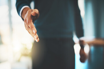 Glad to meet you. a businessman extending his arm for a handshake.