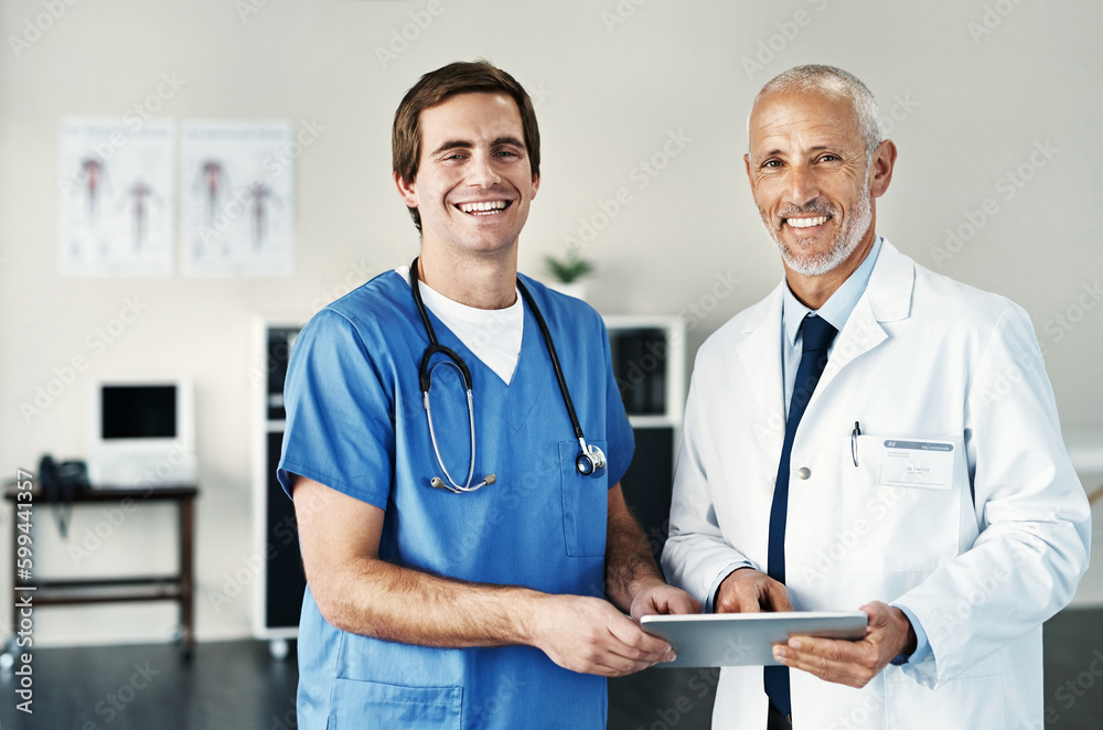 Aufkleber its one of the smartest tools in our trade. portrait of two medical practitioners using a digital ta
