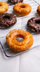 Old fashioned donuts with original and chocolate flavors in the photo in an elegant kitchen