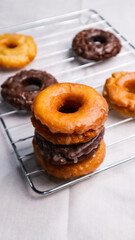 Old fashioned donuts with original and chocolate flavors in the photo in an elegant kitchen