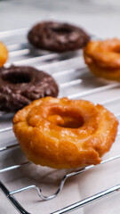Old fashioned donuts with original and chocolate flavors in the photo in an elegant kitchen
