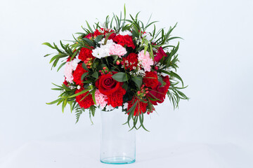 Many expensive flowers beautifully arranged in a vase