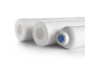 New water filter cartridges isolated on white background, closeup