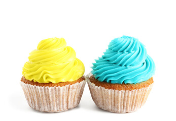 Tasty colorful cupcakes on white background