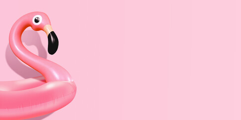 Trendy Summer composition made of pink flamingo inflatable on bright light pink background.Minimal summer concept.Creative art,Contemporary style.Banner background with writing space and copy space.