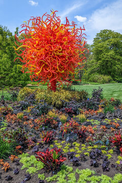 St. Louis, Missouri - April 28, 2023: Orange Fire Tree Chihuly Glass at Missouri Botanical Garden