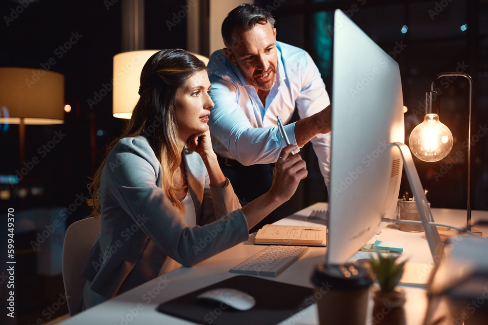 Poster you wont find a more dedicated team. a businessman and businesswoman using a computer during a late 