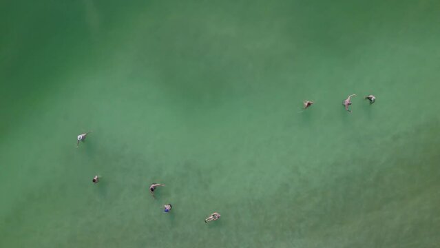 People with psoriasis in the Dead Sea - slow motion static top down shot