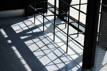 The sunlight shines into the building as a shadow.