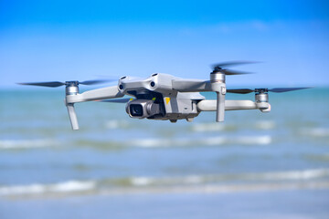Aerial equipment Drone with Digital Camera on the mountain background.Technology concept