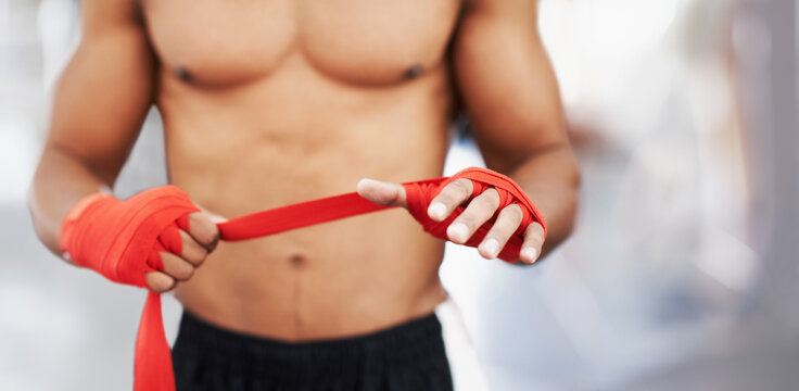 No Bare Knuckles Here. A Man Strapping His Hands And Wrists Before A Fight.