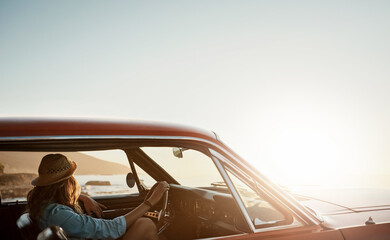 Life can lead you on a beautiful journey. a young woman enjoying a road trip along the coast.